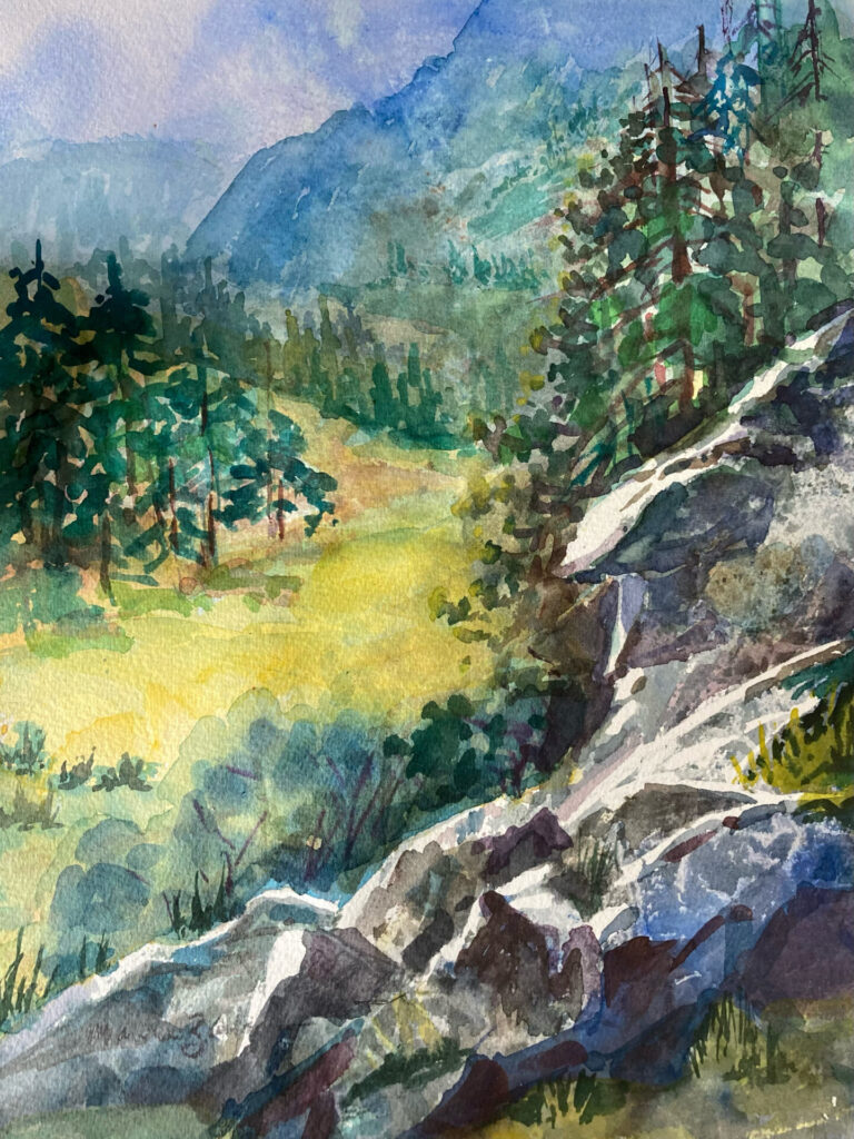 Art by Marina Zavalova. A tranquil watercolor painting by Marina Zavalova, depicting a lush mountain landscape with vibrant greens, a serene meadow, and rugged rocky terrain in the foreground.